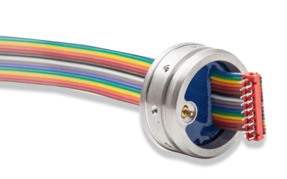 Ribbon cable feedthroughs create a simple plug-in design for customers integrating electronics inside a housing.