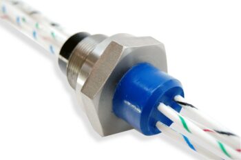 High voltage hermetic wire feedthrough for switchgear applications