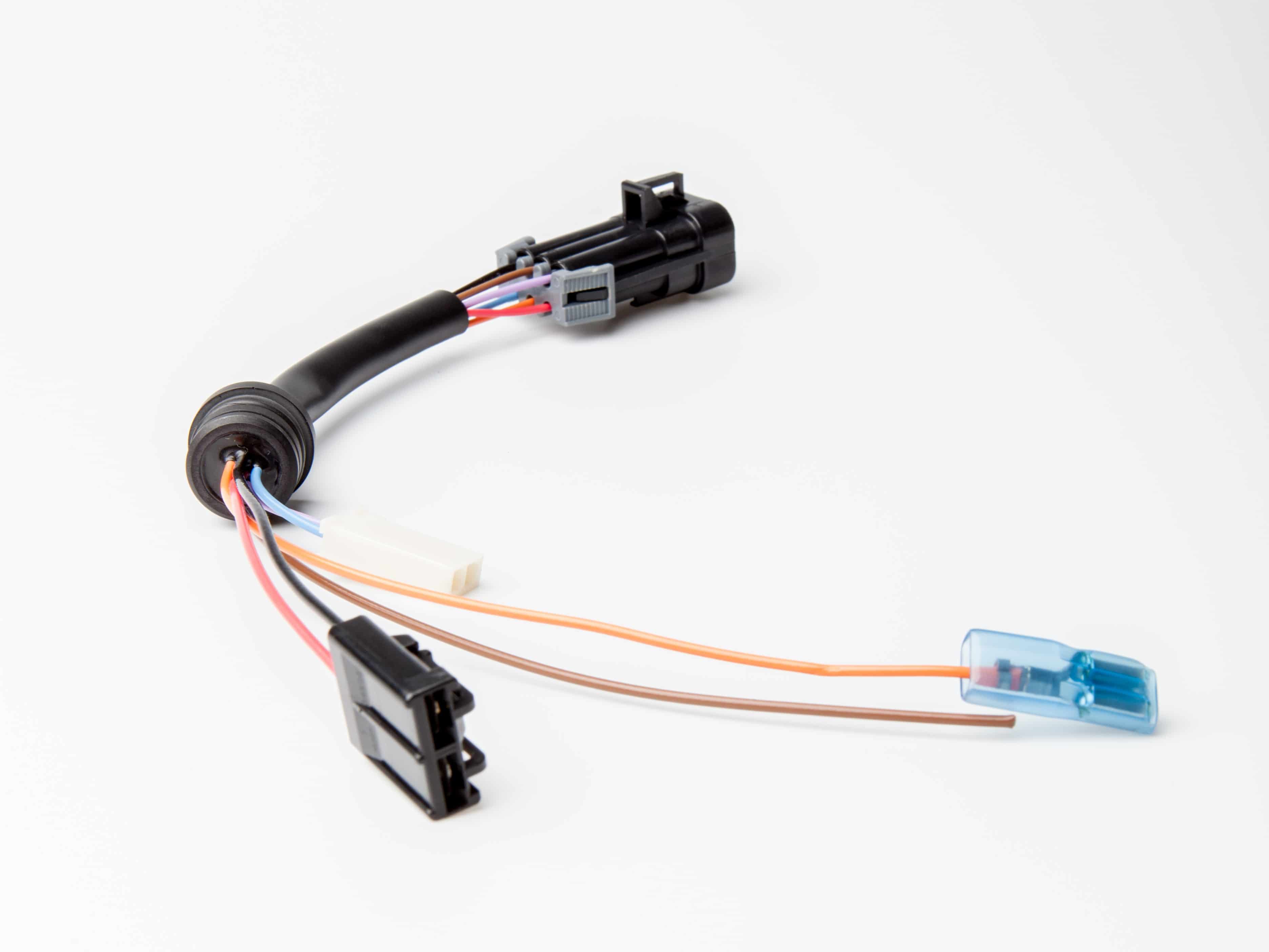 hermetically sealed automotive wire seal with integral connectors for plug-and-play install